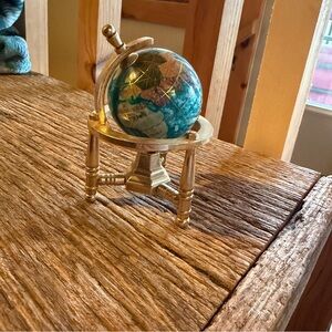 World globe on brass tripod stand - 4” tall - teal - spinning